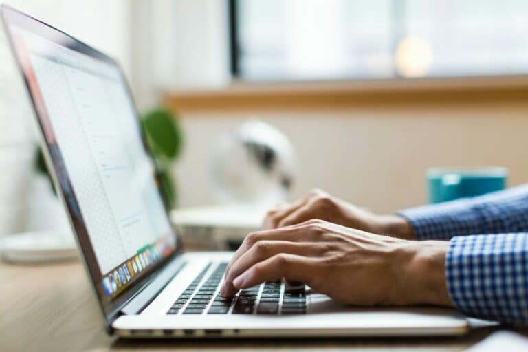 Is-Your-Business-Losing-Money-Because-Employees-Cant-Use-Tech-scaled.jpg person typing on silver Macbook