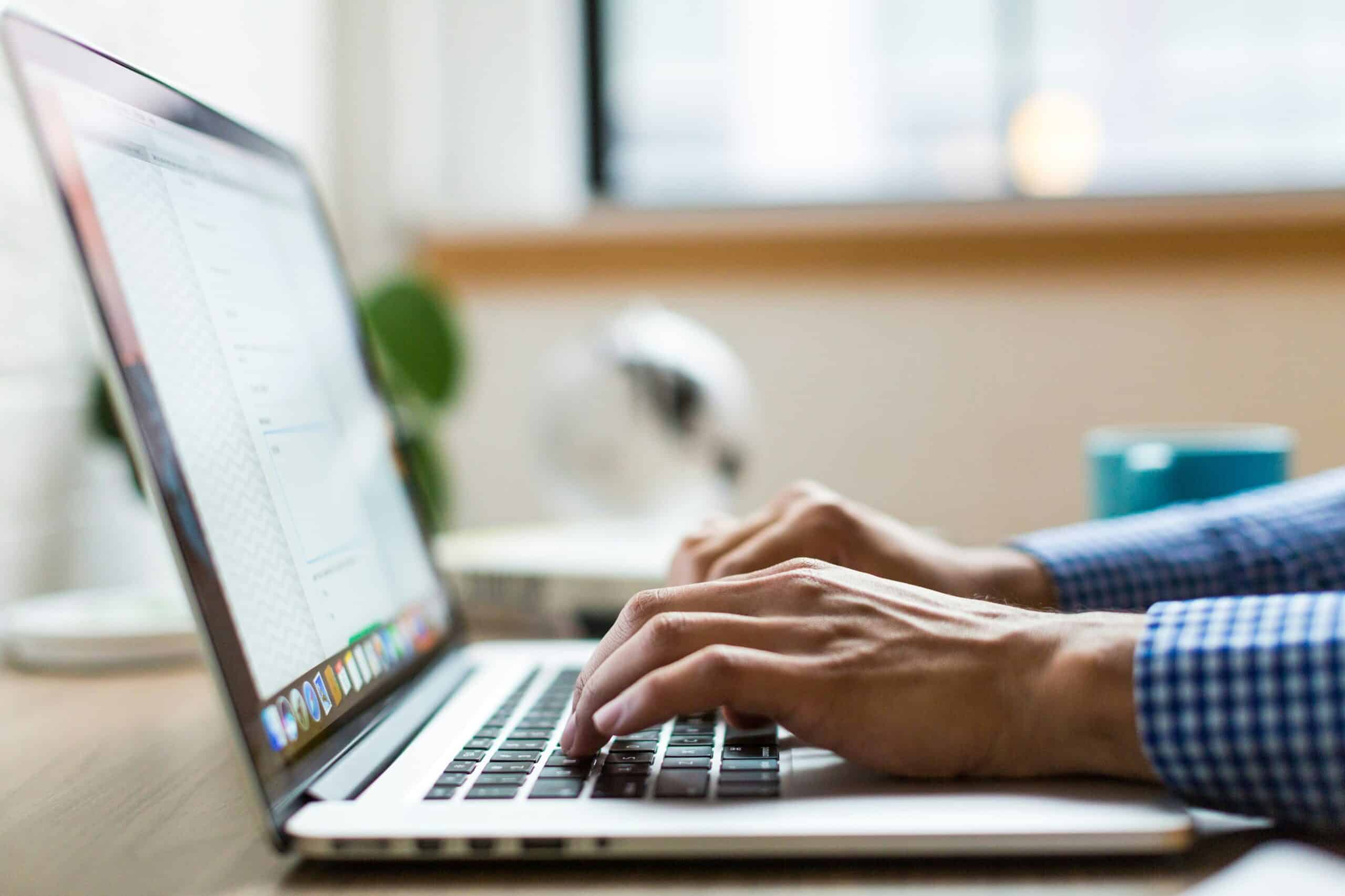 Is-Your-Business-Losing-Money-Because-Employees-Cant-Use-Tech-scaled.jpg person typing on silver Macbook